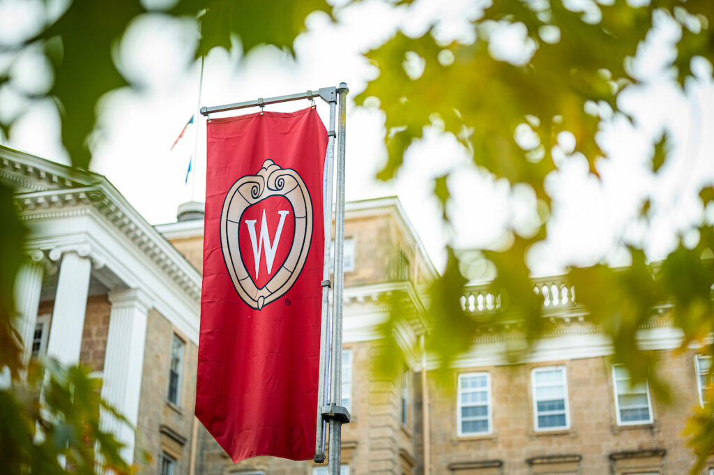 A W crest banner on Bascom Hill is pictured among the colors of the fall leaves at the University of Wisconsin-Madison during autumn on November 8, 2021.