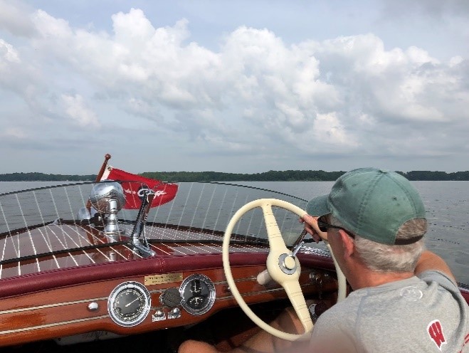 Mark Walters steering his boat on the lake.