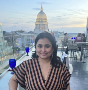 Ankita Bharadwaj pictured in front of WI capitol skyline