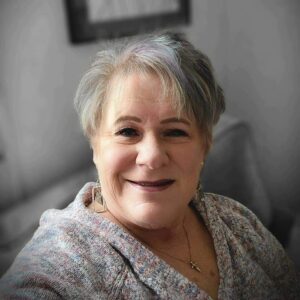 Headshot of Lynn Sullivan against gray background